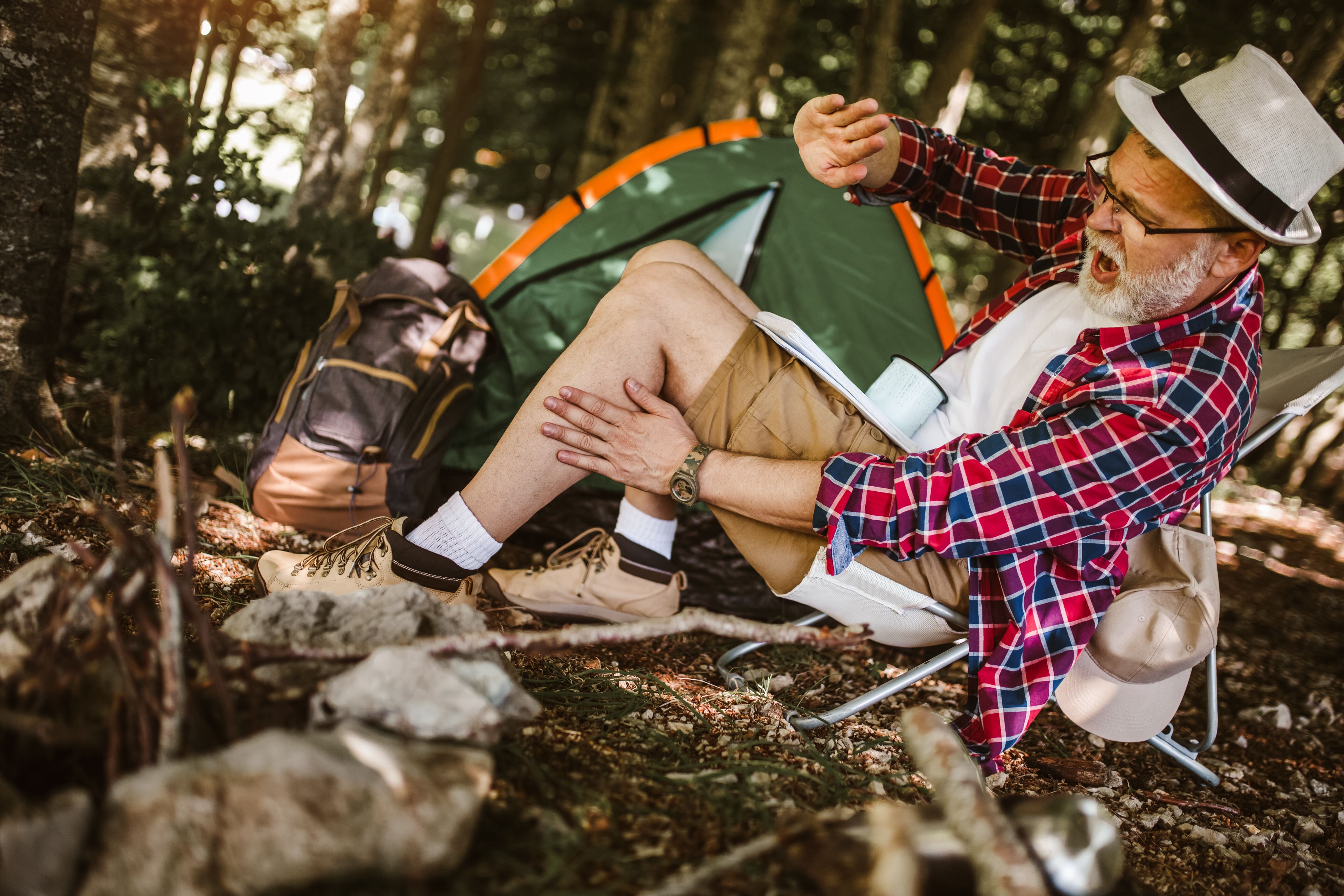 BuzzHawk AI Mosquito Zapper - Orange and grey portable design with UV light and LED flashlight